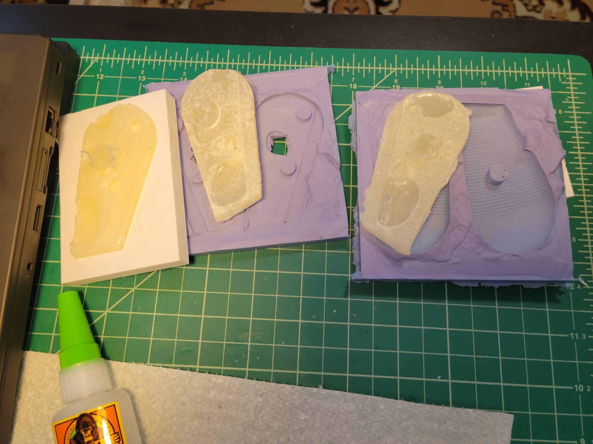 Resin poured into both silicone and 3D printed molds for the grip sections
