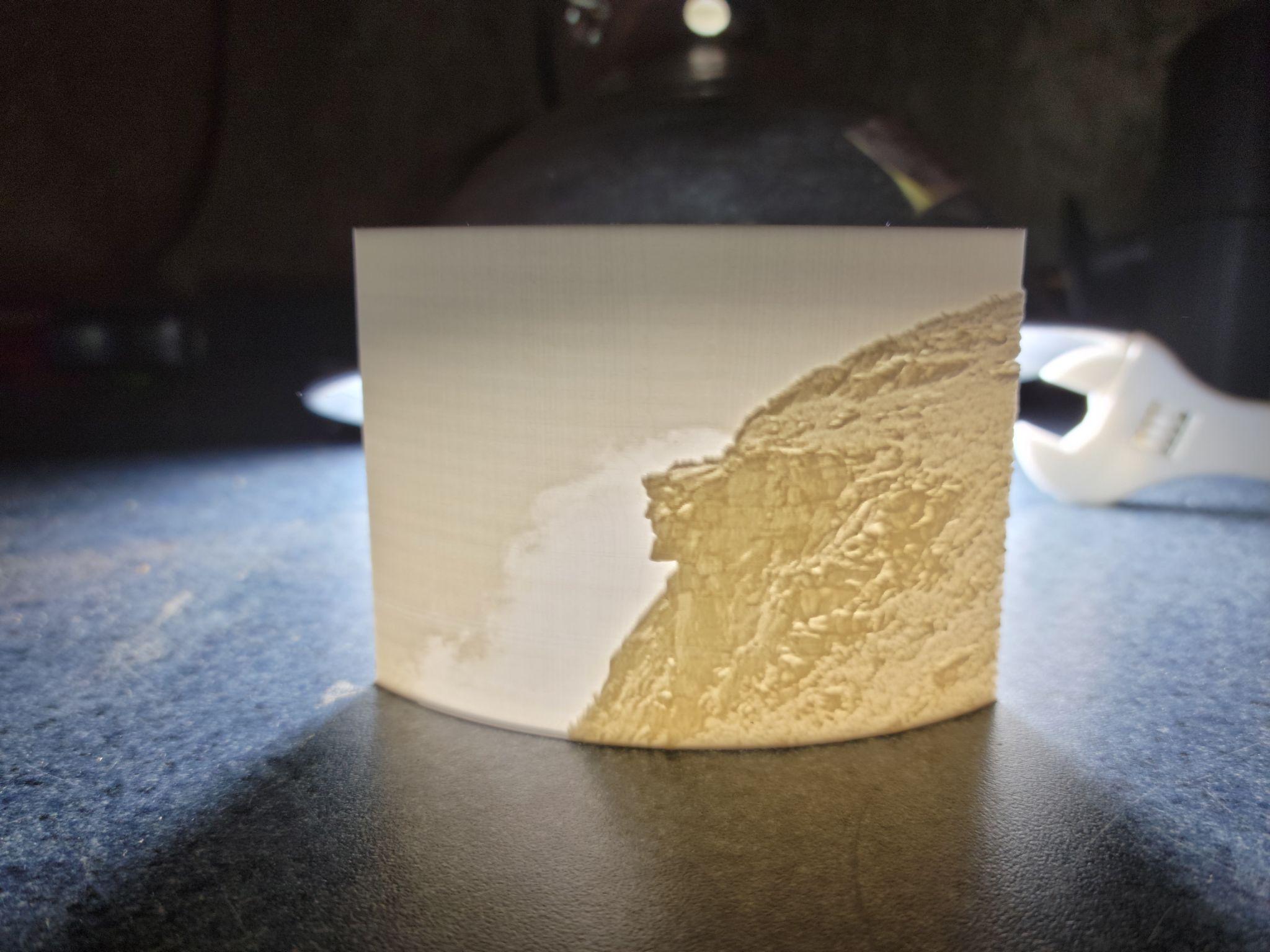 A lithophane — an image embedded in translucent PLA that only reveals itself when backlit