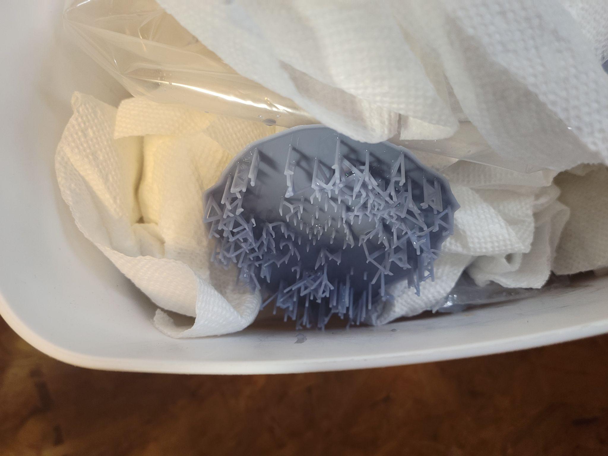 A failed resin print — part detached from the build plate mid-run. Diagnosing and recovering from failures like this is part of the learning curve.