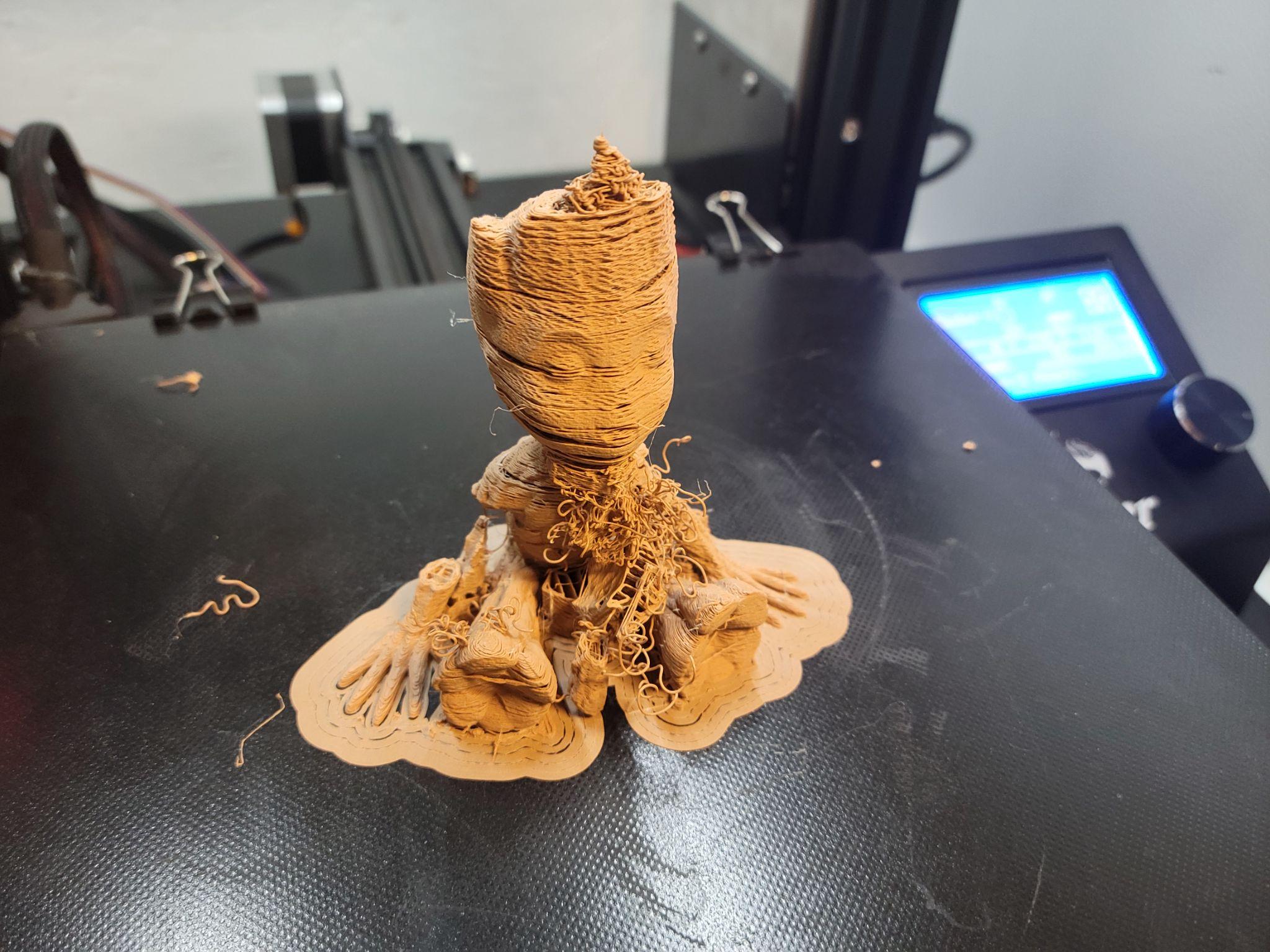 A failed wood PLA print — stringing and clogging were persistent problems with this material